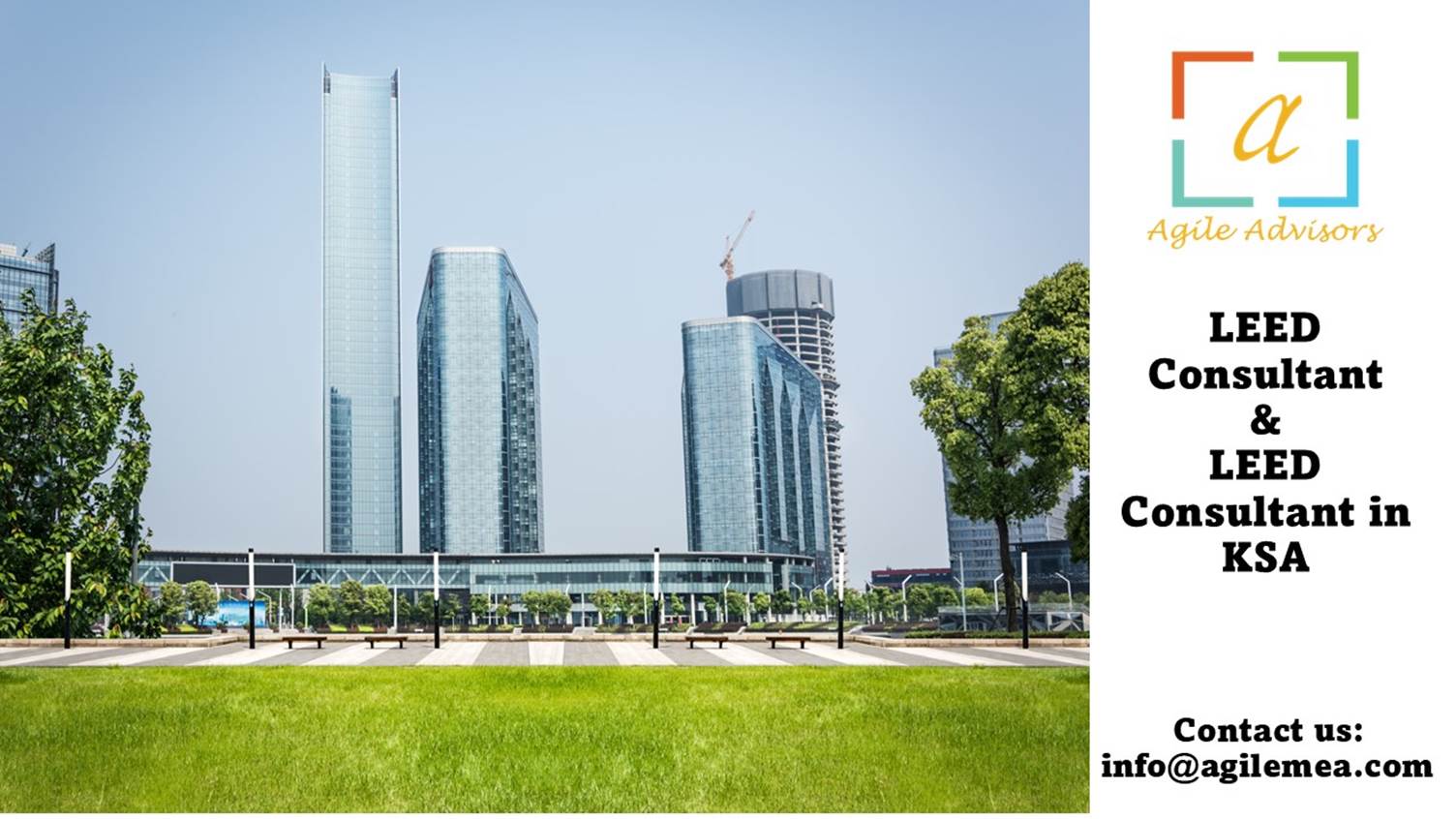 A green lawn with tall buildings in the backgroundAI-generated content may be incorrect.