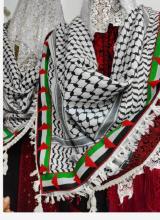 original Palestinian keffiyeh, adorned with the vibrant colors of the Palestinian flag