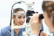 Person discussing Free of Specs vision care options with an eye specialist during a professional eye consultation session