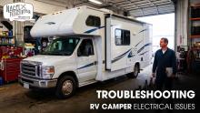 An RV Camper parked inside a Workshop for Electrical Repair Works
