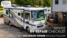A Class A Motorhome Parked Outside of a Workshop for Repair Works