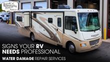 A 2013 Winnebago Vista 35F Class A Motorhome Parked Outside of an RV Repair Shop
