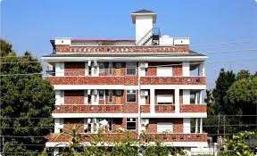 the palatial homes building in day time best homestay in dehradun