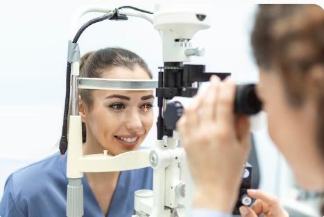 Person discussing Free of Specs vision care options with an eye specialist during a professional eye consultation session