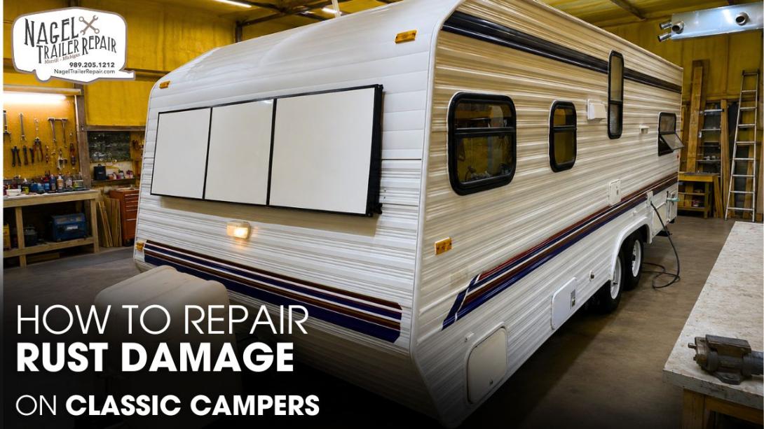 A Classic Camper Trailer parked inside a Workshop for Repair Works